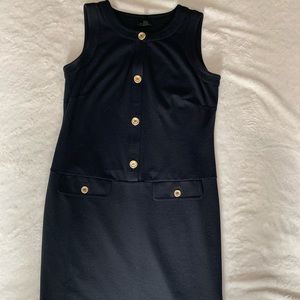Black sleeveless dress with gold buttons